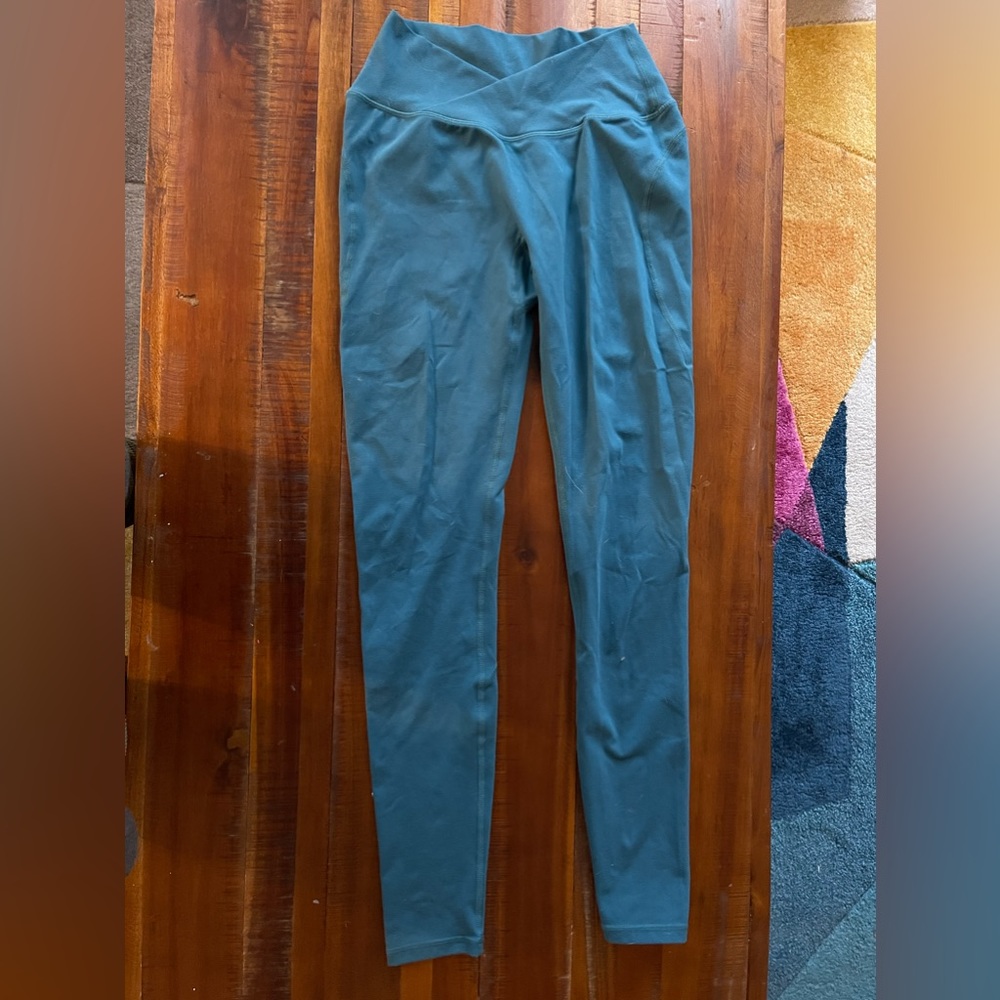 Alphalete Surface Path leggings with cross over front